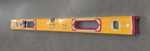 A 32-inch Stabila Type 196-2 yellow aluminum spirit level with red end caps, a central handle, and three vials, wrapped in clear protective film.
