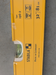 Close-up of the Stabila Type 196-2 spirit level showing the vial housings, center horizontal vial window, and the yellow aluminum frame with structural ridges.