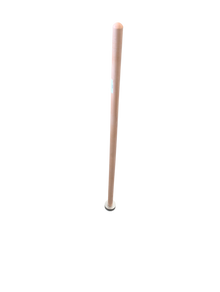 A light-colored wooden handle with a circular white cap resting on a retail store floor near metal rake heads.