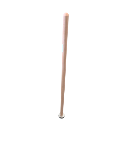 A light-colored wooden handle with a circular white cap resting on a retail store floor near metal rake heads.