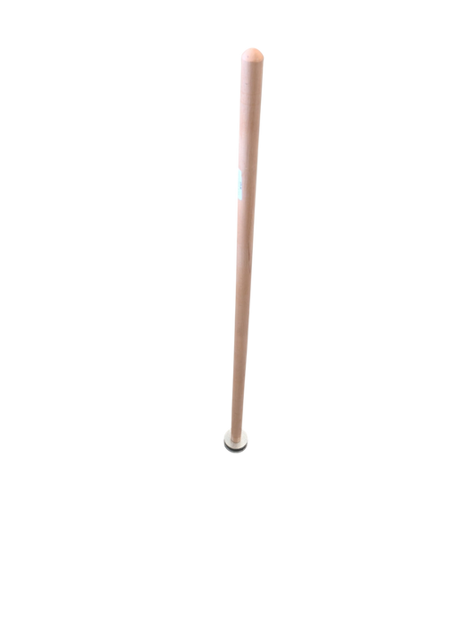 A light-colored wooden handle with a circular white cap resting on a retail store floor near metal rake heads.