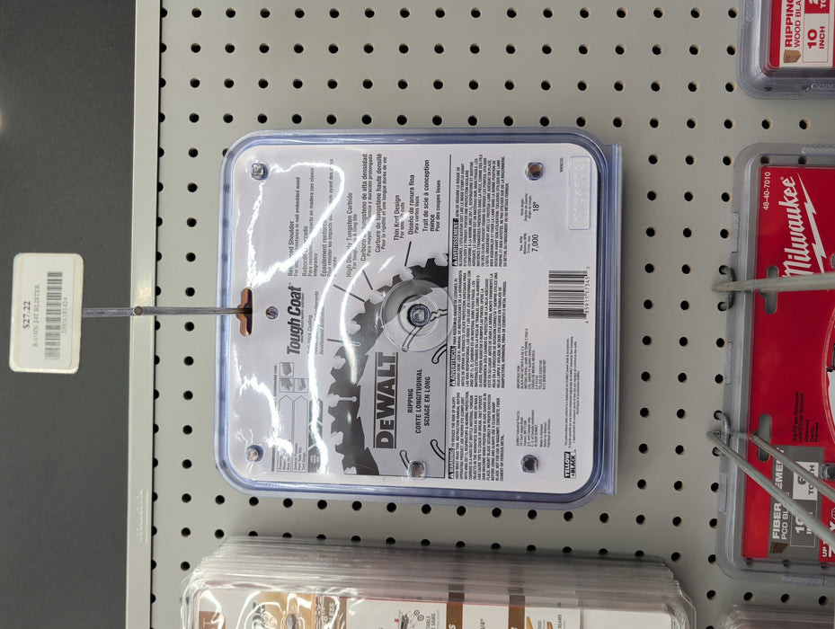 The back of a DEWALT circular saw blade retail package showing safety information, specifications, and warning icons.