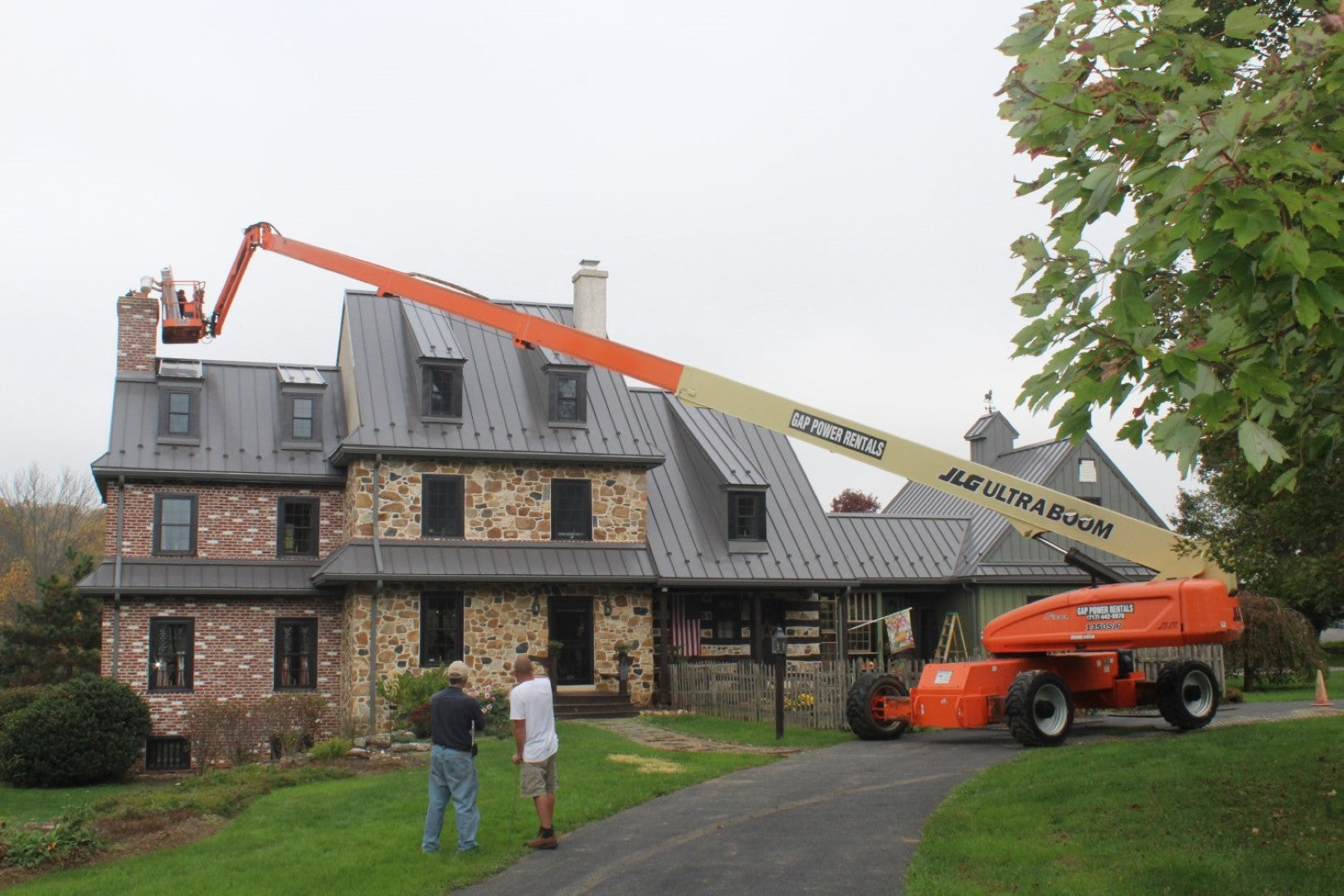 jlg-lifs-boom-rental-135-over-house
